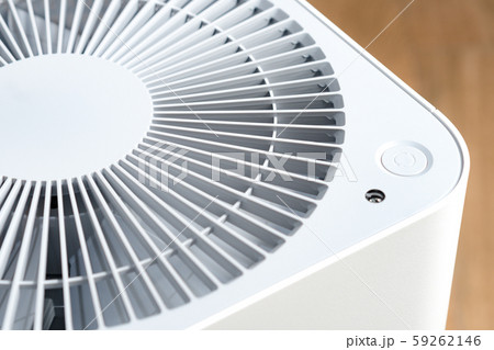 Closeup top view of Air purifier ventilation fan, a household appliance that improve air quality and prevent allergies. PM 2.5, Particulate pollution, Asthma attacks, Lung disease, Air pollutants. Closeup top view of Air purifier ventilation fan, a household appliance that improve air quality and prevent allergies. PM 2.5, Particulate pollution, Asthma attacks, Lung disease, Air pollutants. 59262146