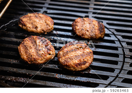 chef making grilled cutlets for burgers chef making grilled cutlets for burgers 59263463