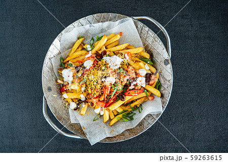french fries with minced meat, beans and vegetables 59263615