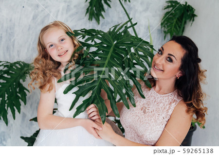 Portrait of a beautiful fashionable mom and daughter's family love 59265138