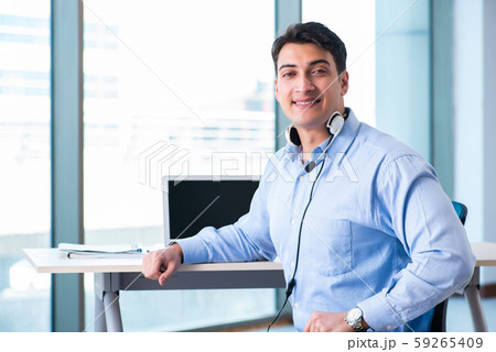 Male call-center operator in business concept 59265409