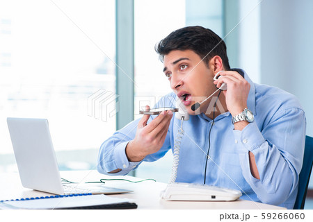 Male call-center operator in business concept Male call-center operator in business concept 59266060