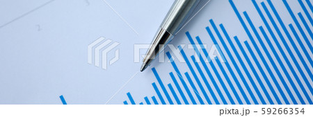 Silver pen lies on paper documents with color 59266354