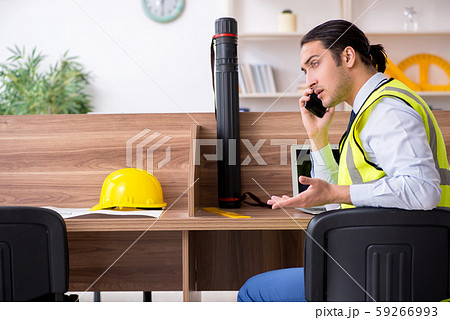Young male architect working in the office Young male architect working in the office 59266993