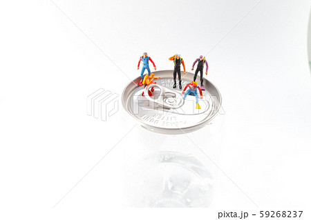 a small diver stands on an open aluminum can a small diver stands on an open aluminum can 59268237