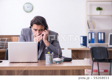 Young male employee in industrial espionage concept 59268653