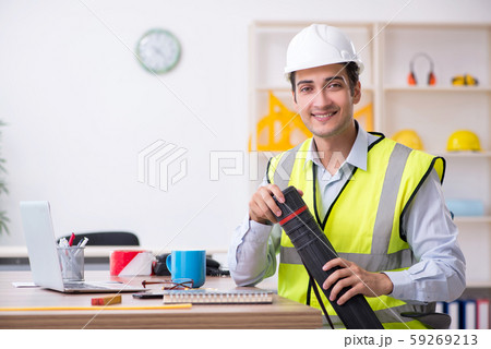 Young male architect working in the office Young male architect working in the office 59269213