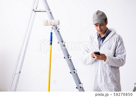 Painter working at construction site Painter working at construction site 59270850