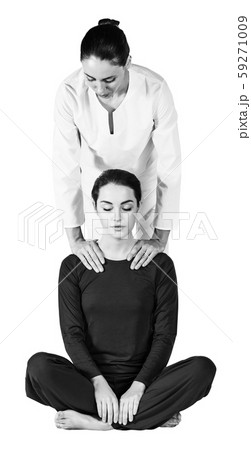 Young woman getting traditional thai stretching massage. Young woman getting traditional thai stretching massage. 59271009