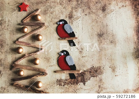 Christmas tree made of wooden branches and bullfinches Christmas tree made of wooden branches and bullfinches 59272186