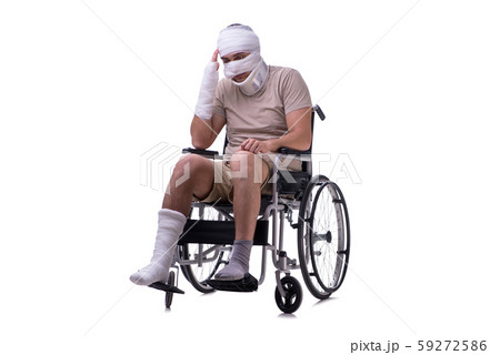 Injured man in wheel-chair isolated on white Injured man in wheel-chair isolated on white 59272586