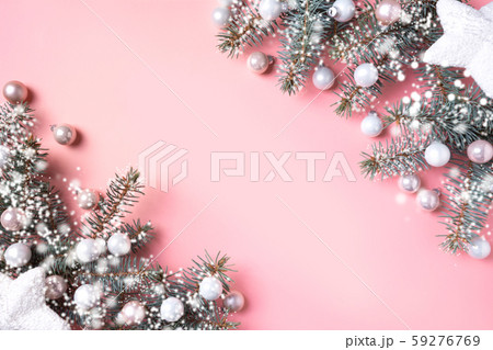 Christmas glass balls and fir branches on pink. Christmas glass balls and fir branches on pink. 59276769