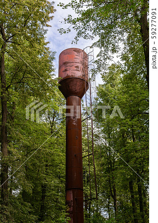 old metal water tower in the forest 59277091