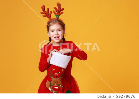 happy funny child girl in red Christmas reindeer 59279676