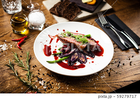 Duck breast served on a plate in restaurant Duck breast served on a plate in restaurant 59279717