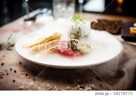 Tuna tartare served on a plate in restaurant 59279775