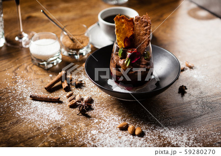 Chocolate mousse served with liquid ice smoke 59280270