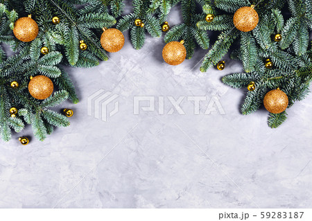 Christmas concrete background with fir tree and golden toys. Christmas concrete background with fir tree and golden toys. 59283187