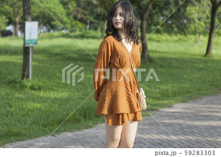 Asian young woman in the park Asian young woman in the park 59283303