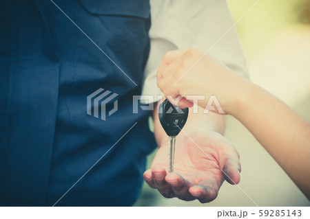 Close up of the woman hand is sending the car keys 59285143