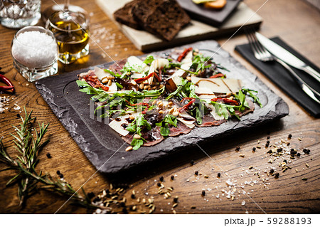 Beef carpaccio served on a board in restaurant Beef carpaccio served on a board in restaurant 59288193