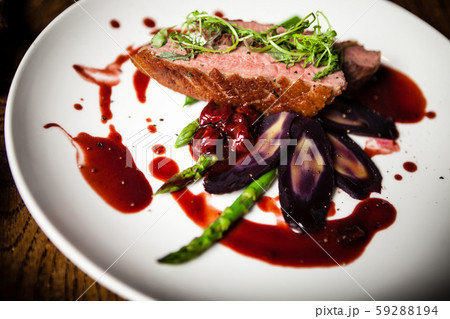 Duck breast served on a plate in restaurant Duck breast served on a plate in restaurant 59288194