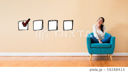 Checklist with woman in a thoughtful pose 59288413