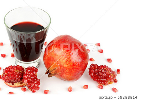 Pomegranate juice in glass and ripe pomegranate 59288814