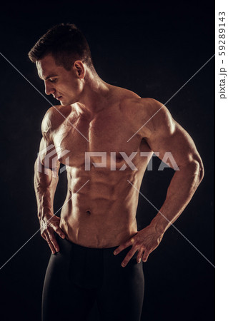 Athletic shirtless young male fitness model posing 59289143