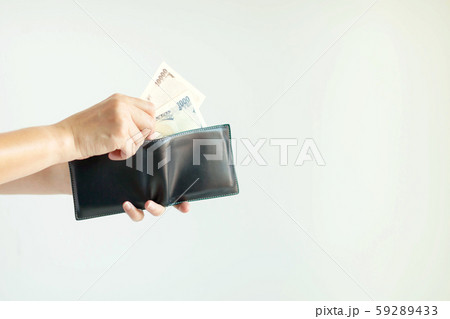 A hand is picking Japan paper money in currency of Yen or JPY; from the short wallet for payment. 59289433
