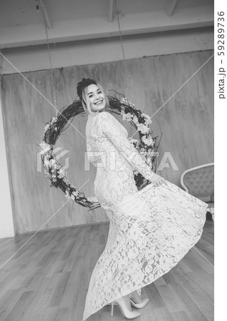Beautiful woman in wedding dress in photo studio. 59289736