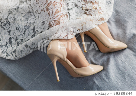Beautiful woman in wedding dress in photo studio. 59289844