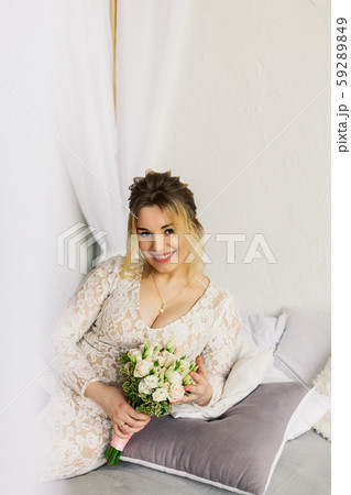 Beautiful woman in wedding dress in photo studio. Beautiful woman in wedding dress in photo studio. 59289849