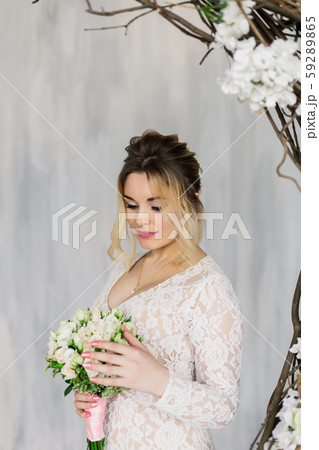Beautiful woman in wedding dress in photo studio. Beautiful woman in wedding dress in photo studio. 59289865