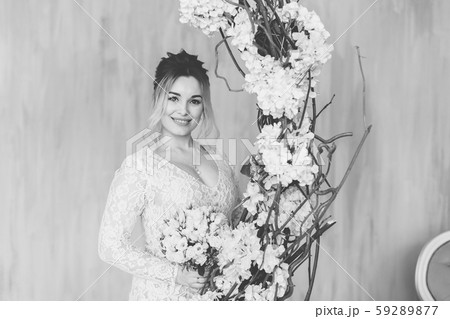 Beautiful woman in wedding dress in photo studio. Beautiful woman in wedding dress in photo studio. 59289877