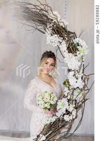 Beautiful woman in wedding dress in photo studio. Beautiful woman in wedding dress in photo studio. 59289882