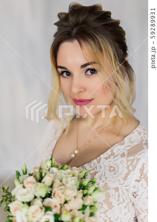 Beautiful woman in wedding dress in photo studio. Beautiful woman in wedding dress in photo studio. 59289931