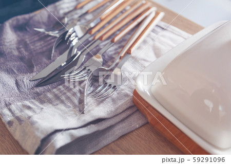 Cutlery drying out on towel 59291096