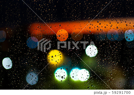 Water drop at windows and bokeh of city in sunset 59291700