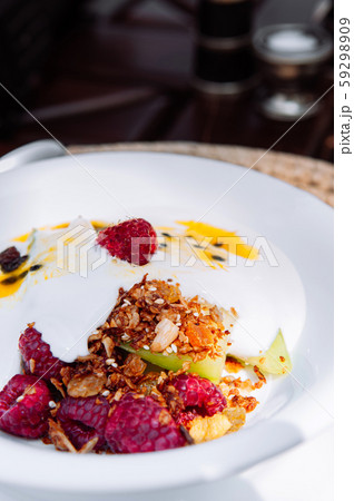 Light healthy breakfast berry yogurt mousli with fresh fruits 59298909