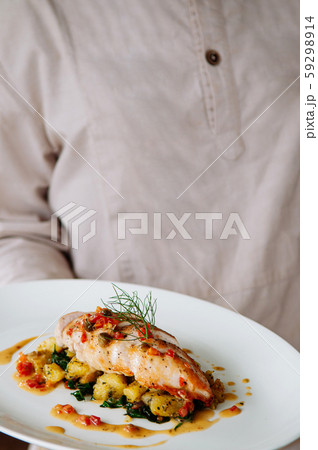 Grill chicken breast with baked potato and kale 59298914