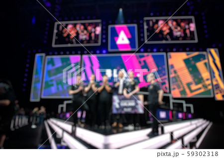 Blurred background of an esports event - Winners of a standoff tournament team with a check in their 59302318