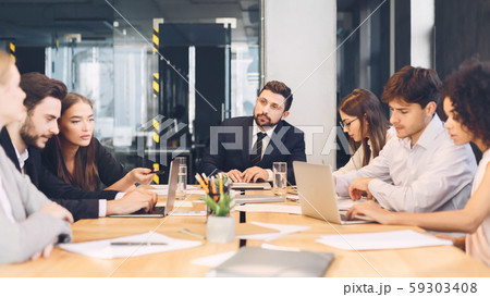 Office discussion. Business corporate meeting of young team Office discussion. Business corporate meeting of young team 59303408