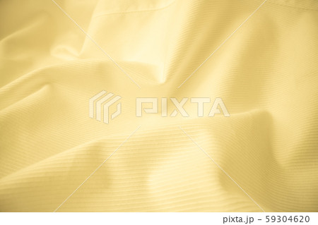 Shiny flowing cloth texture in macro shot. Shiny flowing cloth texture in macro shot. 59304620