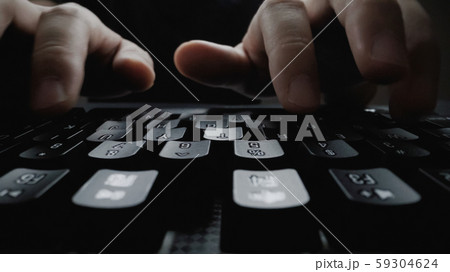 Close-up soft-focus finger typing on keyboard. Close-up soft-focus finger typing on keyboard. 59304624