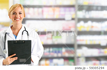 Woman pharmacist working at pharmacy. 59305294