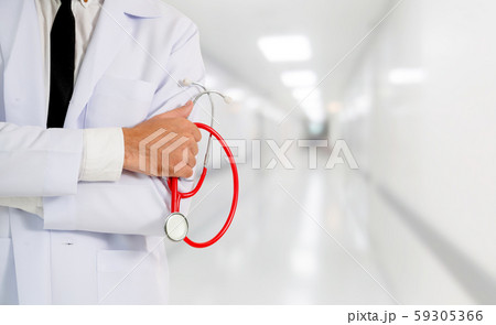 Young male doctor working at the hospital. 59305366