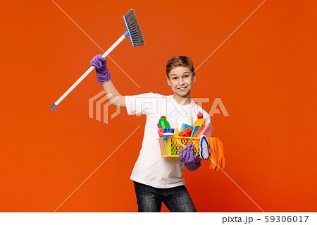 Playful teenager dancing with detergents and mop 59306017