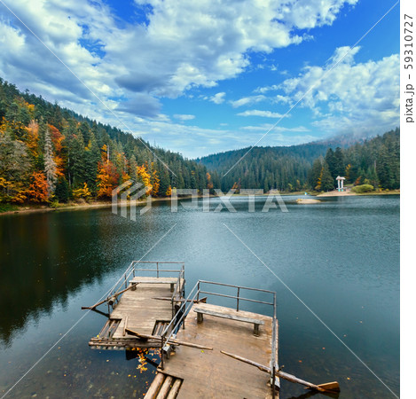 Lake Synevyr autumn view. 59310727