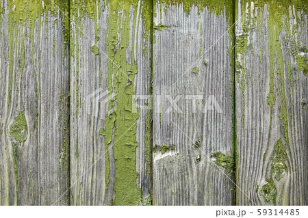 Shabby green paint on old facade boards, wood texture. 59314485